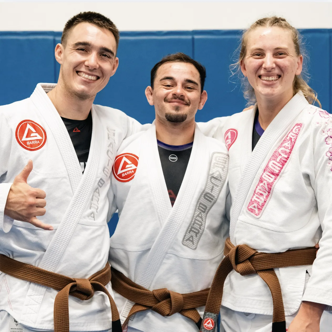 Smiling Gracie Barra adult students in their gis